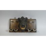 A Nice Quality Black Forest Wall Hanging Pipe Rack with Carved Boar's Head and Four Brass Pipe