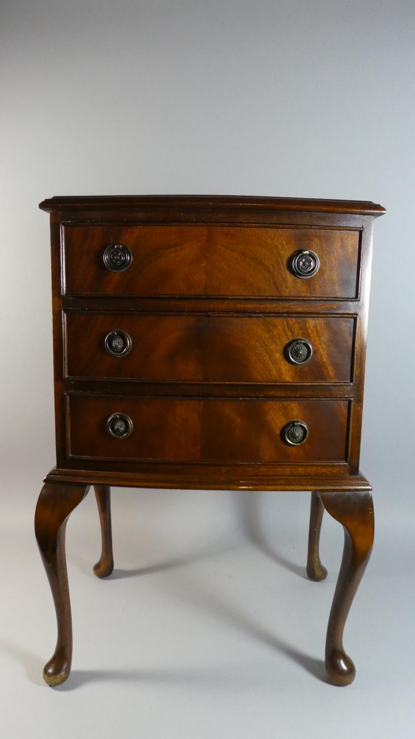 A Small Mahogany Bow Fronted Three Drawer Chest on Cabriole Legs, 45cm Wide and 77cm Tall