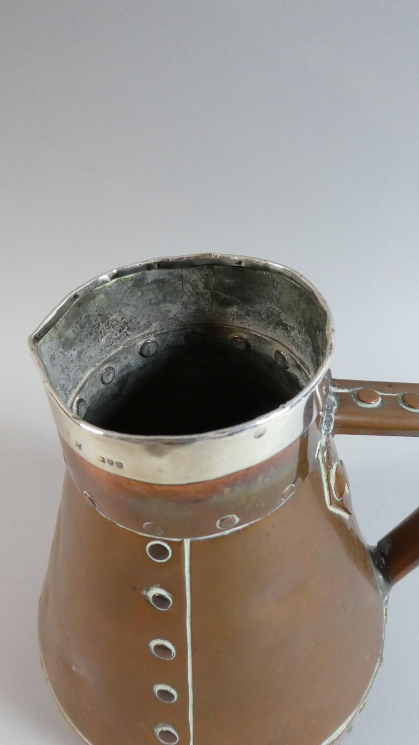 A Hand Beaten Silver Rimmed Copper Jug in the Arts and Crafts Style, 17.5cm High - Image 5 of 5