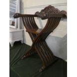 An African X Framed Carved Wooden Elephant Chair with Lion Mask Arm Rests, 86cm High