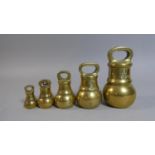A Set of Five Graduated Brass Bell Weights, the Tallest 12cm High