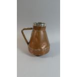 A Hand Beaten Silver Rimmed Copper Jug in the Arts and Crafts Style, 17.5cm High