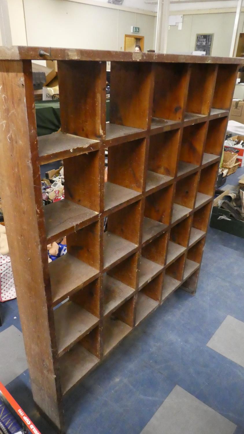 A Wall Mounting Twenty-five Section Rack, 120cm Wide