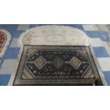 A Chinese Oval Woollen Rug and a Hearth Rug