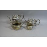 A Victorian Silver Plated Four Piece Teaservice with Embossed Fruit Decoration