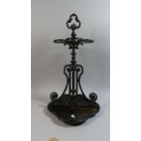 A Painted Cast Iron Four Division Stick Stand with Metal Base Tray, 60cm High