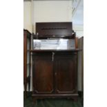 An Edwardian Mahogany Cocktail Cabinet with Fitted and Mirrored Illuminated Top Section and