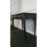 A 19th Century Rectangular Oak Side Table with Carved Top Rails and Turned Supports Culminating in