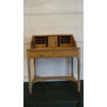 A Pine Ladies Writing Desk with Two Drawers, Turned Supports, Stretcher Shelf and Fitted Top with