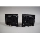 A Pair of Mid 20th Century Ebonised Bookends is the form of Elephants, Some Losses, 9cm High