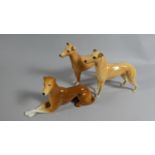 A Collection of Three Greyhound Ornaments Including Two Beswick