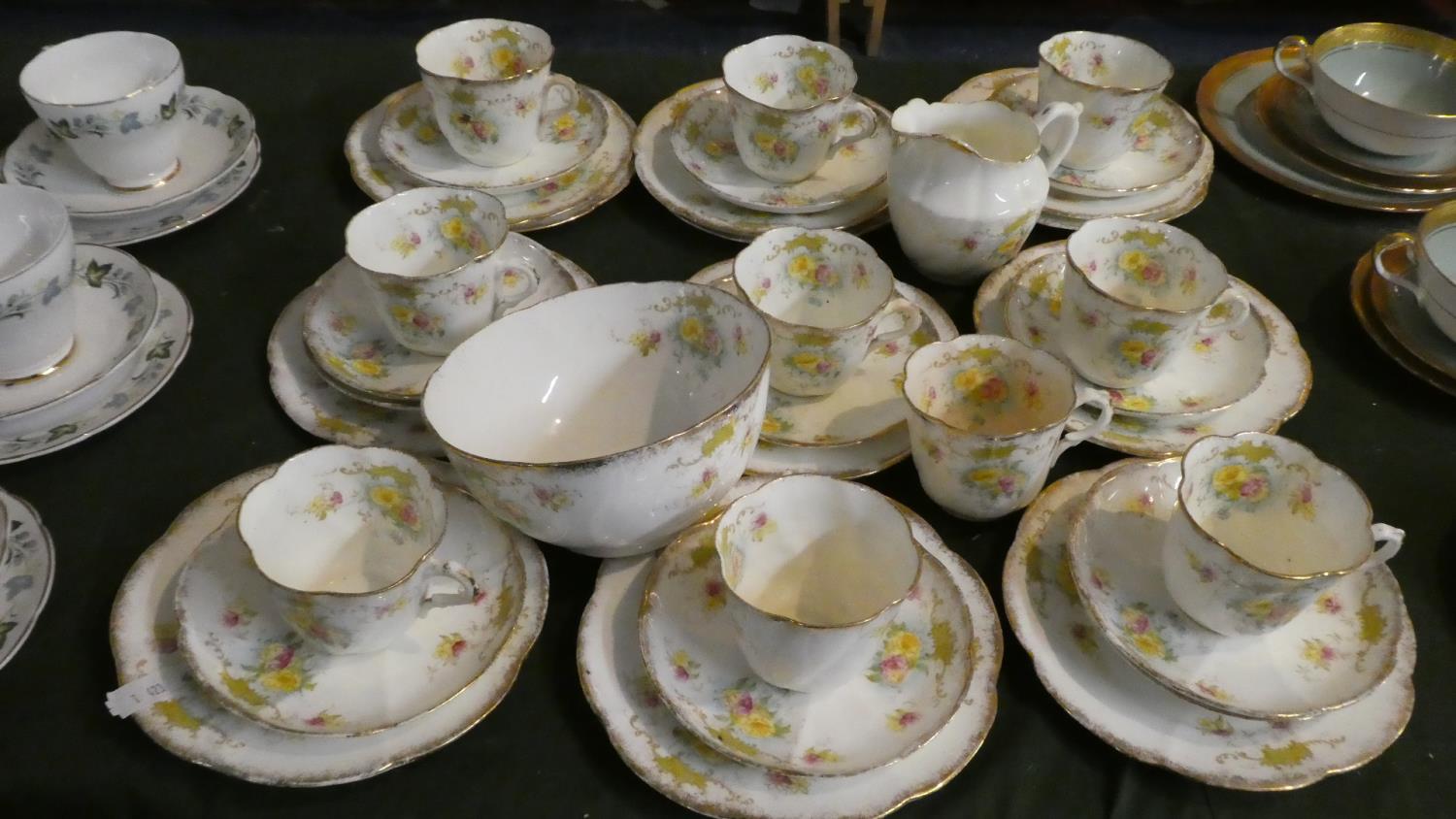 A Collection of Royal Albert Crown China Teawares to Include Nine Trios, Sugar and Cream etc