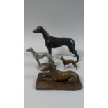 A Collection of Four Various Metal Greyhound Figures