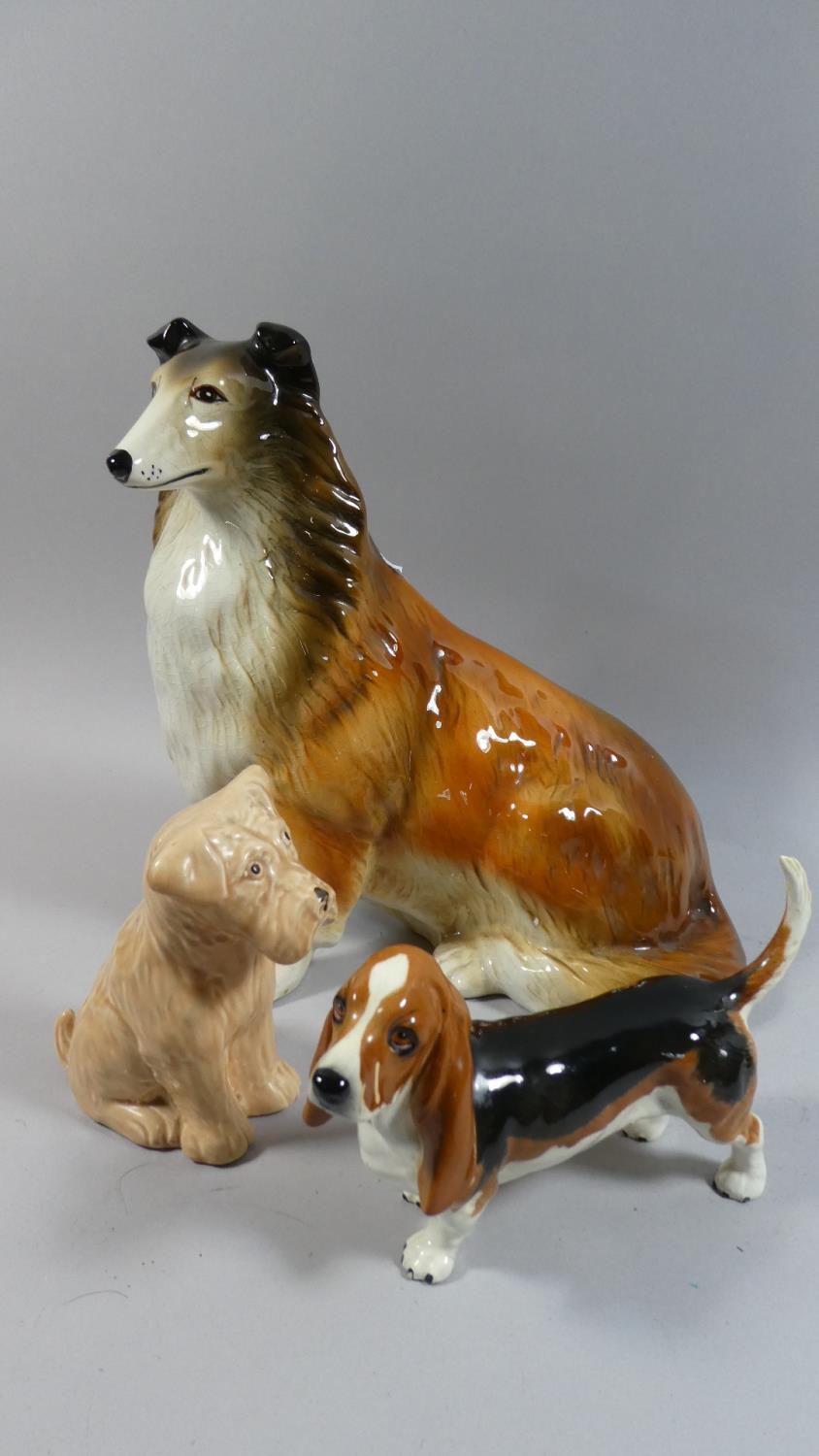 A Collection of Three Dog Ornaments to Include Beswick Basset Hound, Sylvac Terrier and Capstone