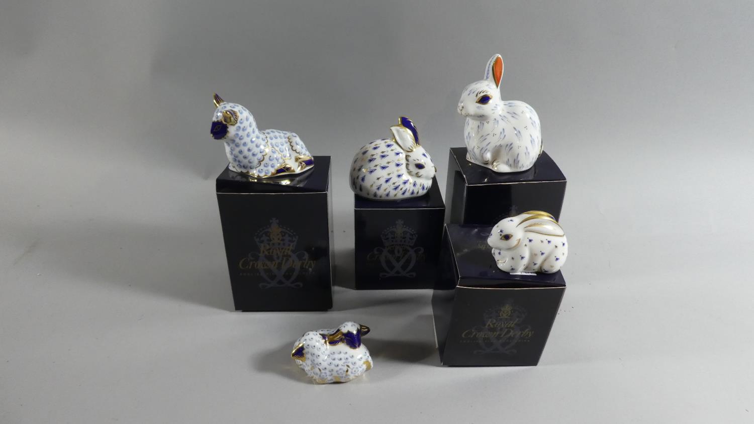 A Collection of Five Crown Derby Paperweights, Gold Buttons, with Four Boxes