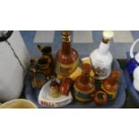 A Collection of Wade Bells Whisky Decanters (Charles and Diana Full), Copper Lustre Jugs, Bells