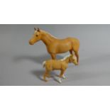 A Beswick Palomino Mare and Foal Ornaments