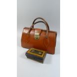 A Small Leather Bag and Cash Tin with Key