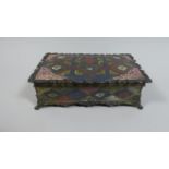 An Enamelled Brass Cigarette Box with Polychrome Decoration, 16.5cm Wide