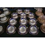 A Set of Eleven Coalport Museum Teacups and Saucers