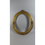 A 19th Century Carved Wood Oval Picture Frame with Original Gilded Decoration. 70x60cms