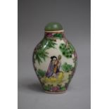 A Chinese Ceramic Snuff Bottle of Rounded Rectangular Form decorated in Famille Rose Enamels with