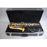 A Cased Lacquered Brass Selmer Bundy II (No 1043738) Saxophone.