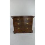 An Arts and Crafts Oak Three Drawer Bedroom Chest with Pierced Apron Rail. 99cms Wide