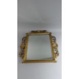 A 19th Century Italian Florentine Carved and Gilded Wall Mirror with a Pierced Rococo Frame.