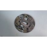 A Japanese Tsuba with Phoenix Decoration and Gilt Highlights, 7cm