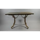 A Mid 20th Century French Centre Table with a Solid Slate Top Supported on Four Gilt Metal