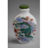 A Chinese Ceramic Snuff Bottle of Flattened Spade Form decorated with Famille Vert Colouration