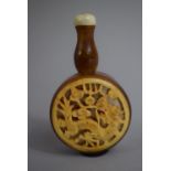 An Oriental Horn Snuff Bottle of Circular Form with Elongated Turned Wooden Cylindrical Neck
