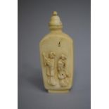 A Chinese Ivory Snuff Bottle of Rectangular Form with Rounded Sloping Shoulders set on Raised Foot