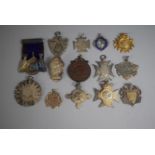 A Collection of 14 Various Sporting Medals including Five Silver Examples.