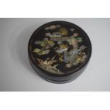 A Chinese Circular Lidded Box with Mother of Pearl Inlay depicting Dragon and Flying Fish, 11cms