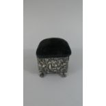 A Pretty Silver Dressing Table Trinket Box/Pin Cushion, Decorated in Relief with Flowers and on Four