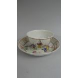 A Chinese Tea Bowl and Saucer decorated with Family Scenes, Interior and Garden.