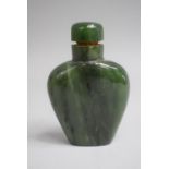 A Chinese Spinach Green Jade Snuff Bottle of Tapered Spade Form complete with Stopper. 6cms High