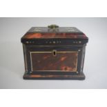 A Mother of Pearl Inlaid Tortoiseshell Tea Caddy of Sarcophagus Form with Canted Sides. 18x12x14cms