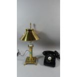 A Vintage Black Telephone and Reproduction Orient Express Brass Mounted Lamp