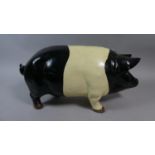 A Cast Metal Large Novelty Money Bank in the Form of a Pig, 45cm Long