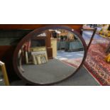 A Large Mahogany Oval Framed Wall Mirror