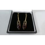 A Pair of 9ct Gold and Amber Drop Earrings