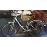 A Ladies Raleigh Bicycle with Wire Baskets Front and Back