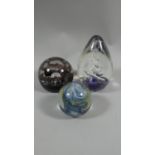 A Collection of Three Glass Paperweights to Include Caithness