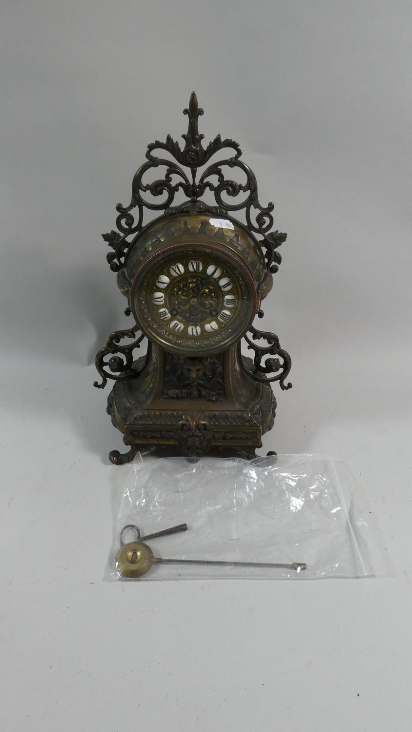 A French Brass Cased Mantle Clock with Key and Pendulum and Movement by Japy Freres. 37cm High