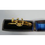 A Continental Yellow Metal Bangle in the Form of Riding Crop and Horse Shoe set with Sapphires and