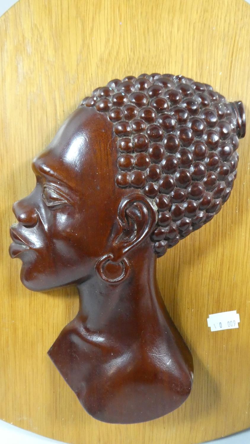 A Carved African Plaque Depicting Maidens Head Together with a Carved African Candle Stick - Image 2 of 3