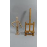 A Wooden Table Top Artists Easel Together with Artists Adjustable Mannequin